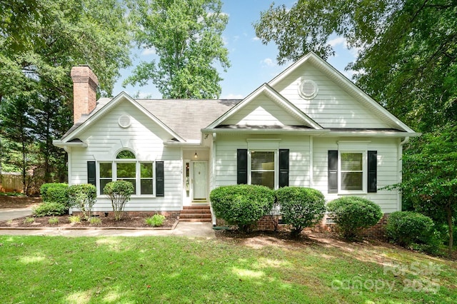 975 Pine Knoll Rd, Fort Mill, SC 29715 - view of front of property with a front yard, a chimney, crawl space, and a shingled roof