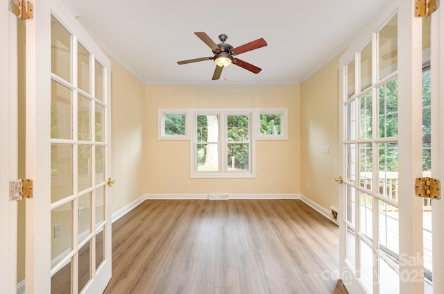 975 Pine Knoll Rd, Fort Mill, SC 29715 - unfurnished room featuring french doors, wood finished floors, crown molding, and ceiling fan