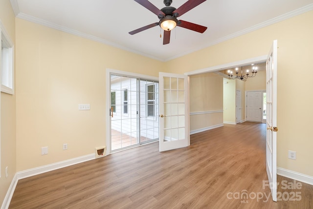 975 Pine Knoll Rd, Fort Mill, SC 29715 - spare room with ornamental molding, light wood-style floors, a chandelier, a ceiling fan, and french doors