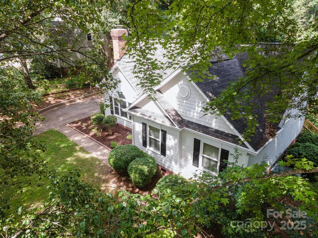 975 Pine Knoll Rd, Fort Mill, SC 29715 - view of side of property with a shingled roof and a chimney