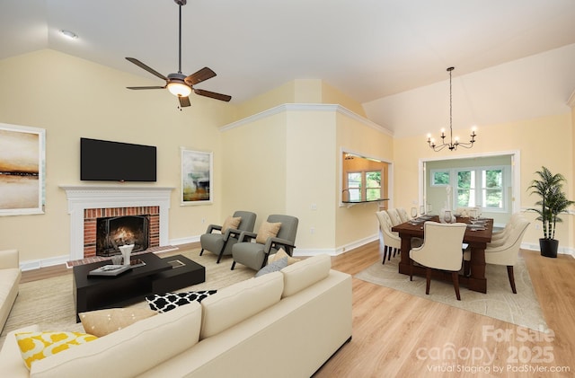 975 Pine Knoll Rd, Fort Mill, SC 29715 - living area featuring wood finished floors, high vaulted ceiling, a chandelier, a brick fireplace, and ceiling fan