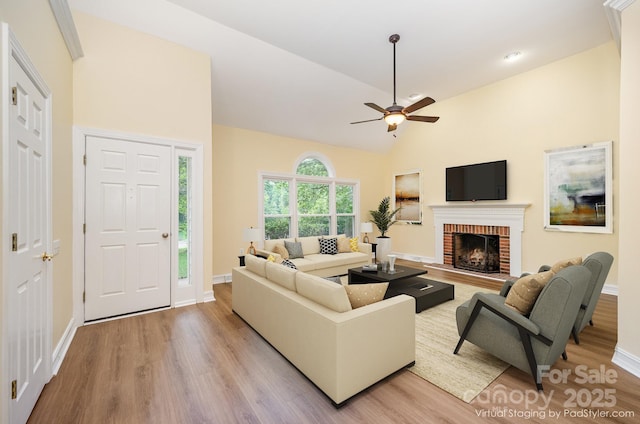 975 Pine Knoll Rd, Fort Mill, SC 29715 - living area with light wood-type flooring, a fireplace, a ceiling fan, and high vaulted ceiling