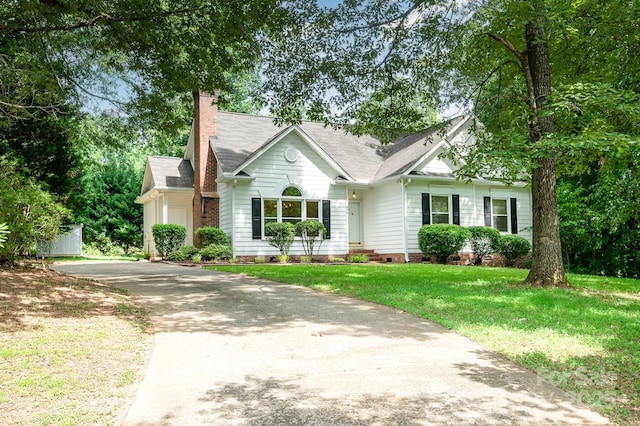 975 Pine Knoll Rd, Fort Mill, SC 29715 - view of front of property featuring crawl space, asphalt driveway, a chimney, a front yard, and roof with shingles