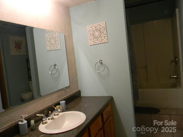 1425 Sorrells Cove Rd, Clyde, NC 28721 - bathroom with vanity and shower / tub combination
