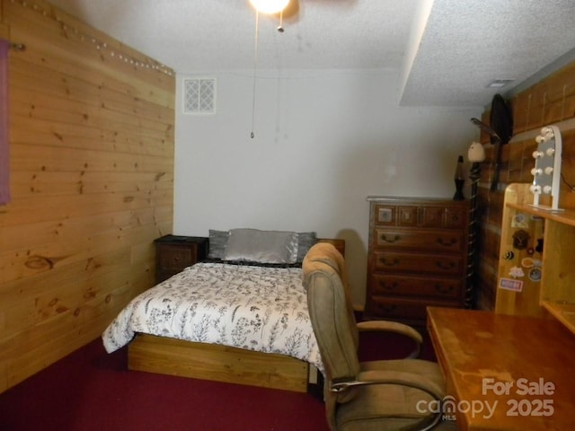 1425 Sorrells Cove Rd, Clyde, NC 28721 - bedroom with a textured ceiling, wooden walls, and ceiling fan