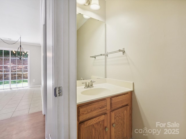 3830 Brookchase Ln, Charlotte, NC 28205 - bathroom with a chandelier and vanity