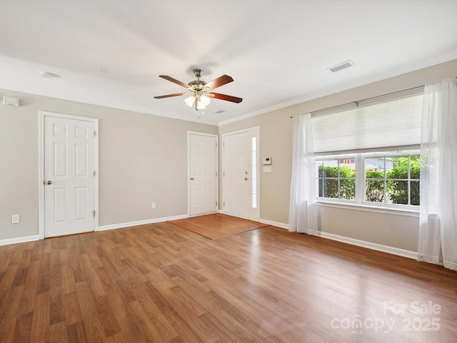 3830 Brookchase Ln, Charlotte, NC 28205 - foyer entrance with wood finished floors, a ceiling fan, and ornamental molding
