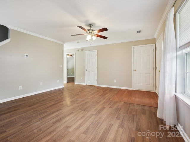 3830 Brookchase Ln, Charlotte, NC 28205 - empty room with ceiling fan, light wood-type flooring, and crown molding