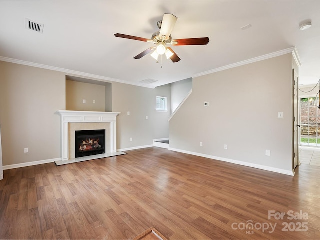 3830 Brookchase Ln, Charlotte, NC 28205 - unfurnished living room with ceiling fan, ornamental molding, wood finished floors, and a lit fireplace