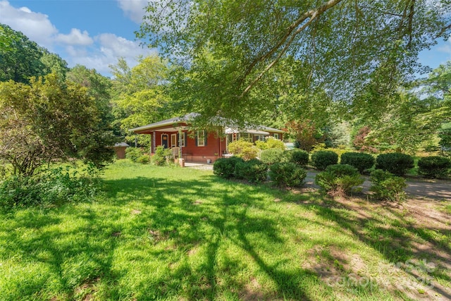 25 Wall Rd, Tryon, NC 28782 - view of green lawn with a porch