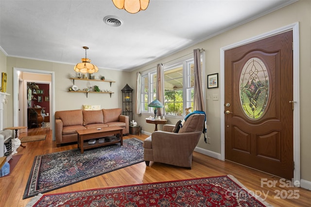 25 Wall Rd, Tryon, NC 28782 - entryway featuring ornamental molding and wood finished floors