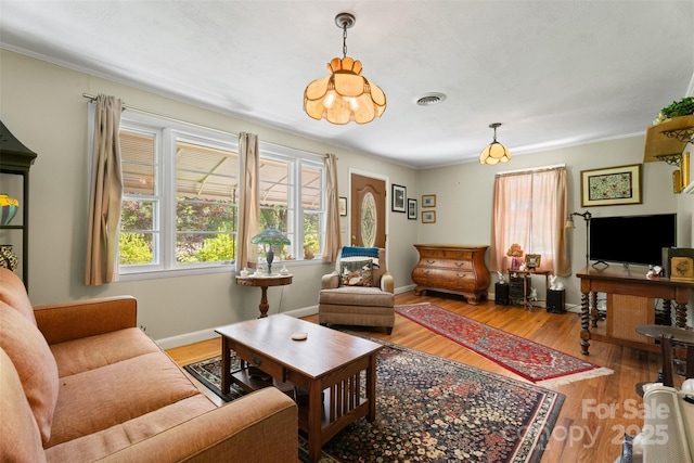 25 Wall Rd, Tryon, NC 28782 - living area with wood finished floors, crown molding, and a chandelier