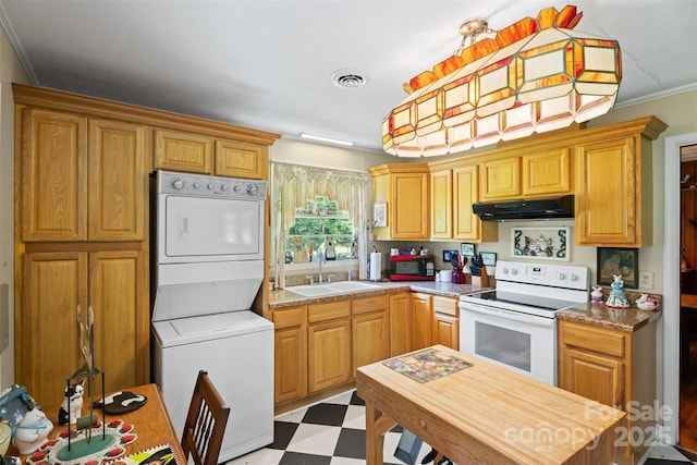 25 Wall Rd, Tryon, NC 28782 - kitchen featuring white electric range oven, under cabinet range hood, stacked washer / dryer, light flooring, and crown molding