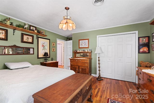 25 Wall Rd, Tryon, NC 28782 - bedroom featuring a closet, wood-type flooring, and ornamental molding