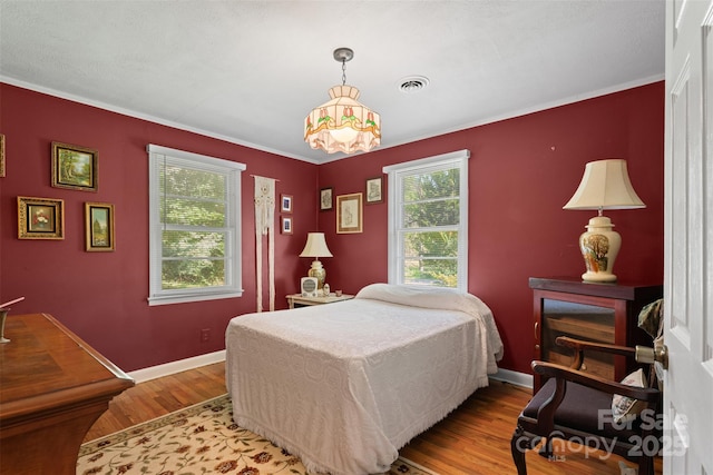 25 Wall Rd, Tryon, NC 28782 - bedroom with wood finished floors and crown molding