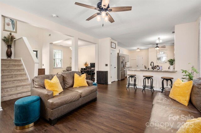 6422 Gatesville Ln, Charlotte, NC 28270 - living area featuring ceiling fan, dark wood-style floors, and stairway