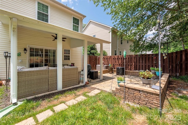 6422 Gatesville Ln, Charlotte, NC 28270 - fenced backyard featuring a patio, an outdoor living space, and ceiling fan