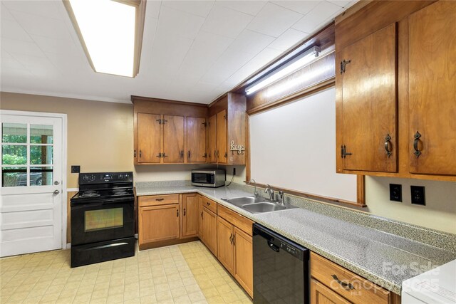 6115 Campbell Rd, York, SC 29745 - kitchen with black appliances, light countertops, brown cabinetry, light floors, and ornamental molding