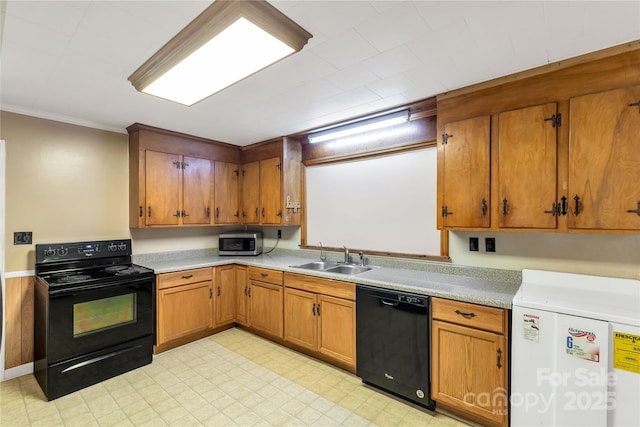 6115 Campbell Rd, York, SC 29745 - kitchen featuring black appliances, brown cabinets, light countertops, ornamental molding, and light flooring