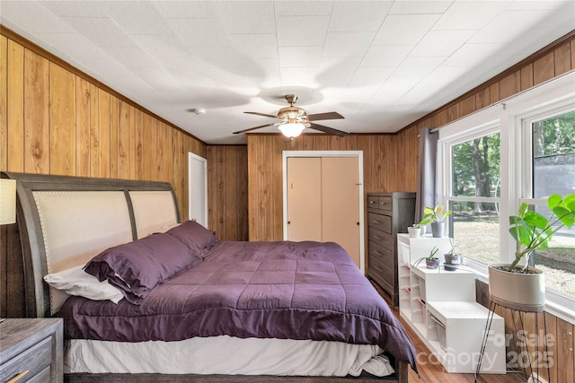 6115 Campbell Rd, York, SC 29745 - bedroom featuring multiple windows, wood walls, and ceiling fan