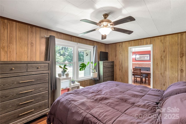 6115 Campbell Rd, York, SC 29745 - bedroom featuring wooden walls and a ceiling fan