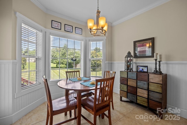 1006 Pin Oak Trl Unit 5, Hendersonville, NC 28739 - dining room with a chandelier, wainscoting, crown molding, and light tile patterned floors