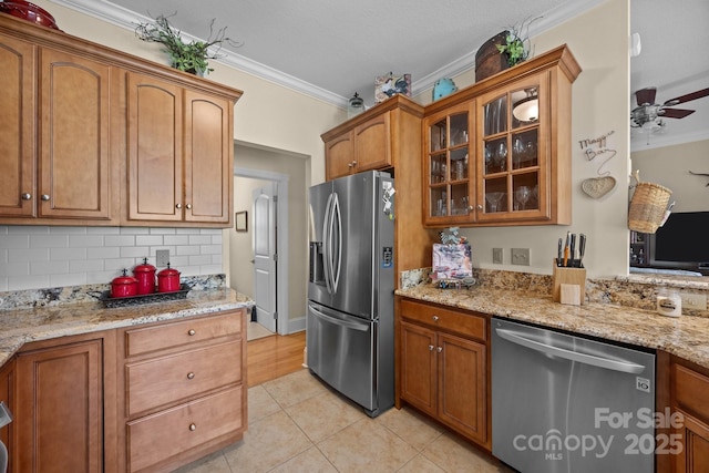 1006 Pin Oak Trl Unit 5, Hendersonville, NC 28739 - kitchen with stainless steel appliances, crown molding, glass insert cabinets, light tile patterned flooring, and decorative backsplash