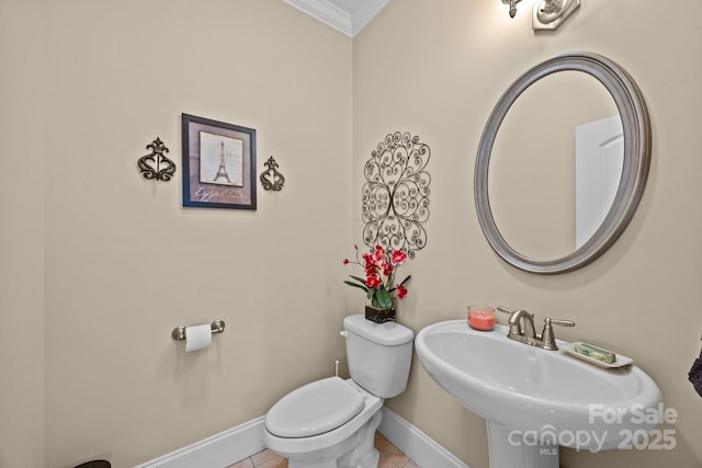 1006 Pin Oak Trl Unit 5, Hendersonville, NC 28739 - half bathroom featuring crown molding and tile patterned floors