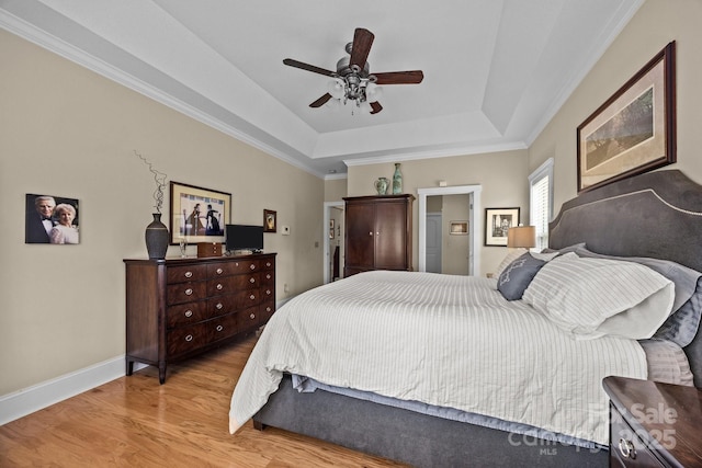 1006 Pin Oak Trl Unit 5, Hendersonville, NC 28739 - bedroom with a tray ceiling, light wood finished floors, crown molding, a ceiling fan, and ensuite bath