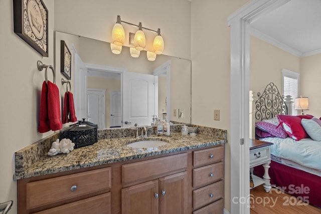 1006 Pin Oak Trl Unit 5, Hendersonville, NC 28739 - bathroom featuring vanity, crown molding, connected bathroom, and wood finished floors