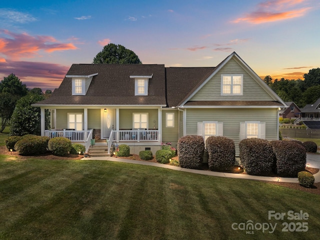 1006 Pin Oak Trl Unit 5, Hendersonville, NC 28739 - view of front facade featuring a lawn, a porch, and roof with shingles