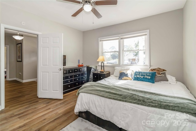 202 Gum St, Pageland, SC 29728 - bedroom with wood finished floors and a ceiling fan