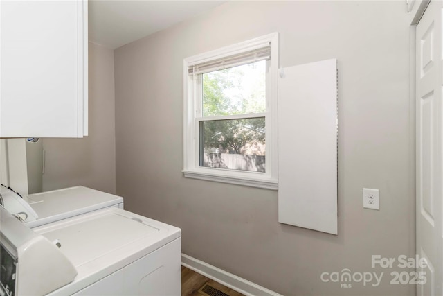 202 Gum St, Pageland, SC 29728 - washroom with washer and dryer, cabinet space, and wood finished floors