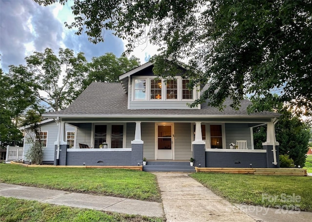 102 Cuthberson St, Morganton, NC 28655 - view of front of house with a front yard, covered porch, and roof with shingles