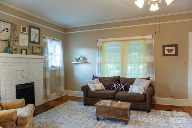 102 Cuthberson St, Morganton, NC 28655 - living room featuring ornamental molding, a fireplace, wood finished floors, and a ceiling fan