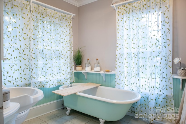 102 Cuthberson St, Morganton, NC 28655 - bathroom with a freestanding tub, tile patterned floors, and ornamental molding