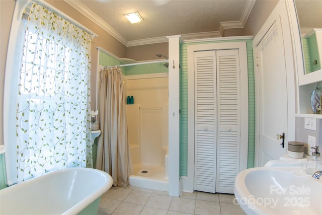 102 Cuthberson St, Morganton, NC 28655 - full bathroom featuring a closet, tile patterned flooring, a shower stall, crown molding, and a textured ceiling