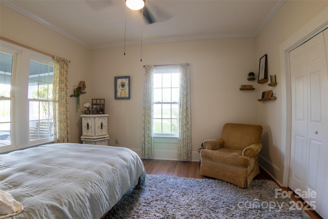 102 Cuthberson St, Morganton, NC 28655 - bedroom featuring ornamental molding, wood finished floors, a ceiling fan, and a closet