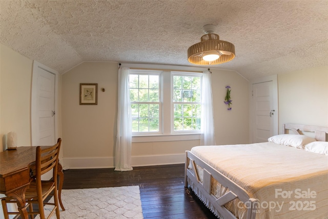 102 Cuthberson St, Morganton, NC 28655 - bedroom featuring a textured ceiling, vaulted ceiling, and dark wood-style flooring