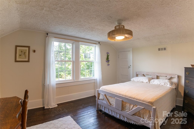 102 Cuthberson St, Morganton, NC 28655 - bedroom with a textured ceiling, vaulted ceiling, and wood-type flooring