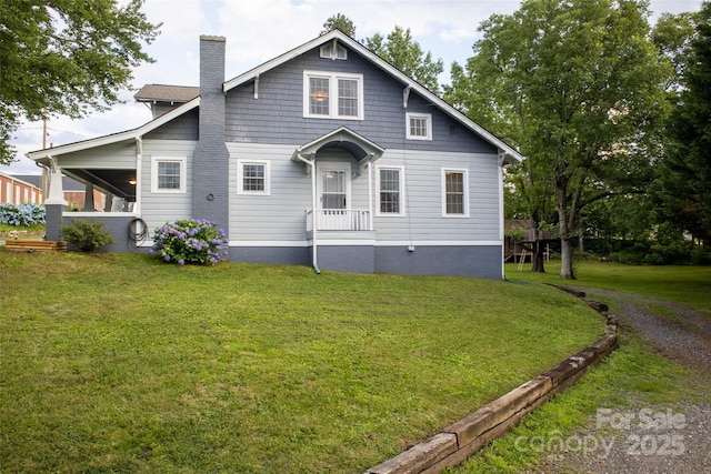 102 Cuthberson St, Morganton, NC 28655 - view of front facade with a chimney and a front yard