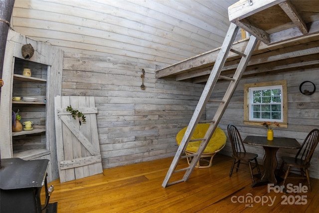 102 Cuthberson St, Morganton, NC 28655 - bedroom with wood walls, wood-type flooring, and lofted ceiling