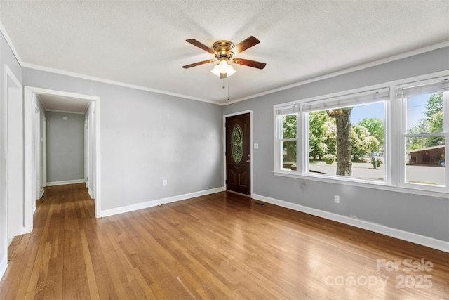 814 W Gold St, Kings Mountain, NC 28086 - foyer entrance with wood finished floors, ceiling fan, ornamental molding, and a textured ceiling