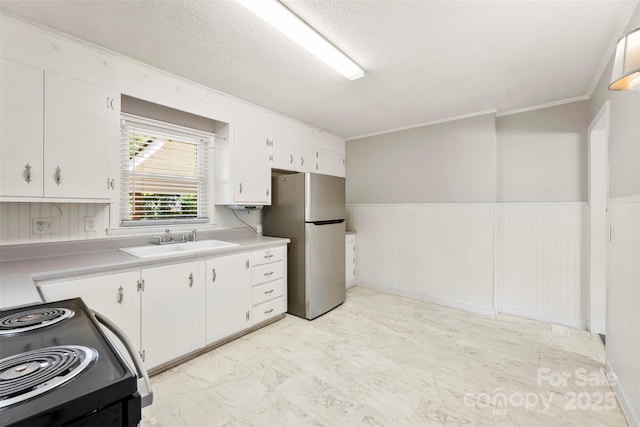 814 W Gold St, Kings Mountain, NC 28086 - kitchen with freestanding refrigerator, electric range, light marble finish flooring, light countertops, and white cabinetry