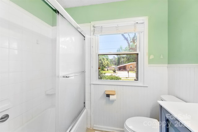 814 W Gold St, Kings Mountain, NC 28086 - full bathroom with vanity, bath / shower combo with glass door, and a wainscoted wall