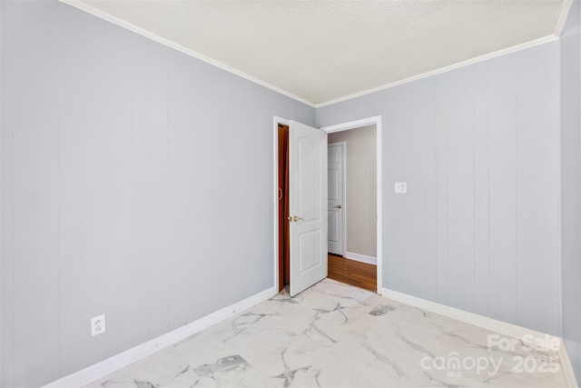 814 W Gold St, Kings Mountain, NC 28086 - spare room featuring light marble finish flooring, ornamental molding, and a textured ceiling