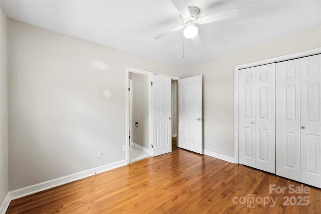 814 W Gold St, Kings Mountain, NC 28086 - unfurnished bedroom featuring light wood-style flooring, a closet, and a ceiling fan