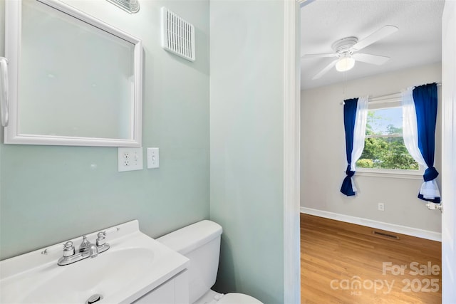 814 W Gold St, Kings Mountain, NC 28086 - half bathroom with ceiling fan, wood finished floors, and vanity