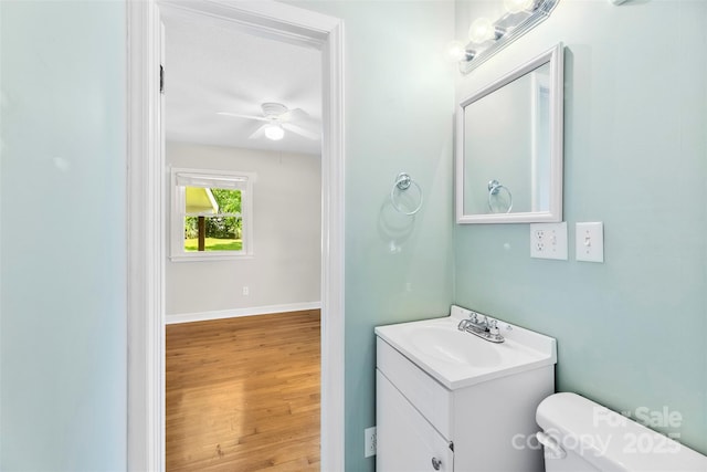 814 W Gold St, Kings Mountain, NC 28086 - bathroom with vanity, a ceiling fan, and wood finished floors