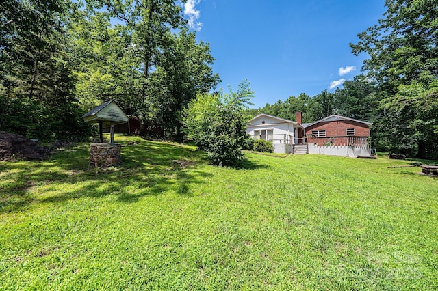 3954 E Burke Blvd, Connelly Springs, NC 28612 - view of grassy yard featuring a wooden deck
